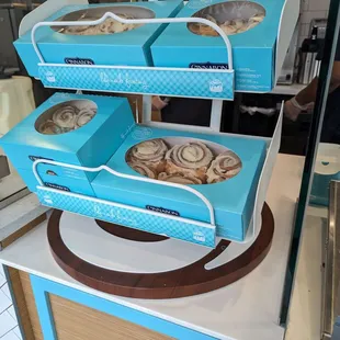 a display of donuts in blue boxes