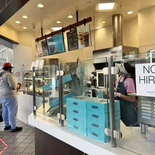 a person standing in front of a counter