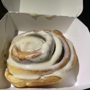 a cinnamon roll in a box