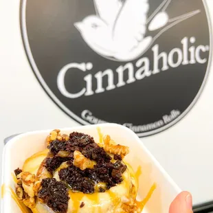 a person holding a container of food