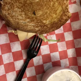 a grilled cheese sandwich with a side of ranch dressing