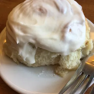 a cinnamon roll with icing