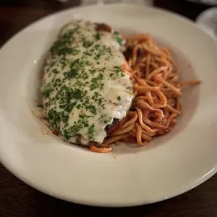 a plate of spaghetti with meat and sauce