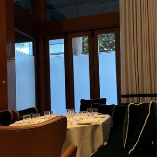 a dining room with a table and chairs