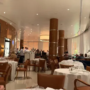 a man sitting at a table in a restaurant
