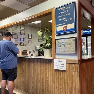 a man standing at a counter