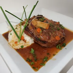 Pork shank with a side of mashed potato