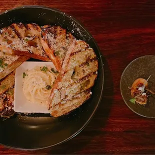 a plate of food and a glass of wine