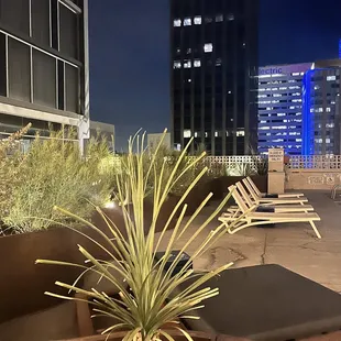 a view of a rooftop pool at night