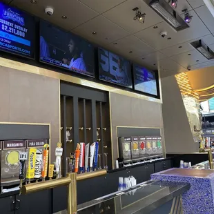 a row of beer taps in a bar