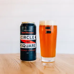 a can and a glass of beer