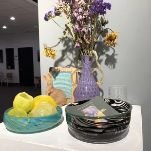 Glass bowls, lemons and vase