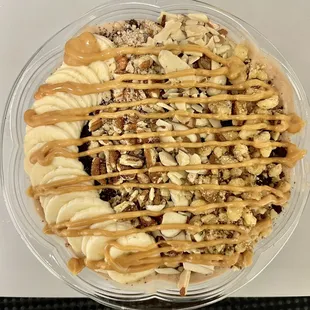 a bowl of oatmeal topped with bananas and nuts