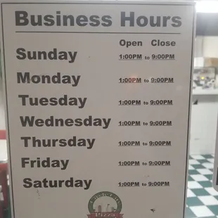 a business hours sign