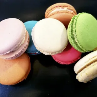 a pile of colorful macarons