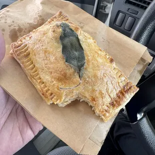 Out of this world sausage, potato and sage hand pie.