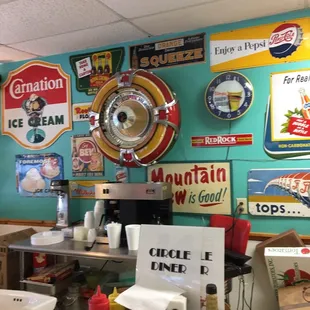 a variety of signs on the wall