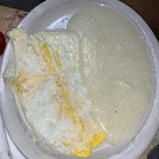 Fried well/hard eggs and grits