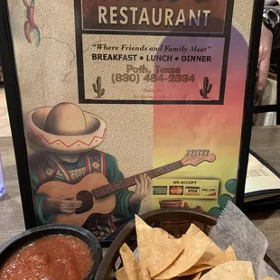 a bowl of chips and a bowl of salsa