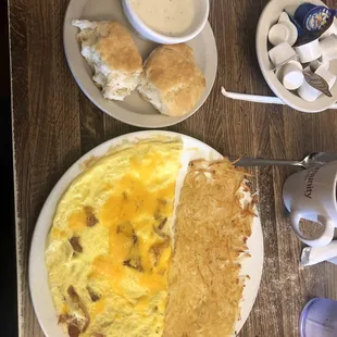 Bacon cheddar omelet, hash browns and biscuits and gravy.