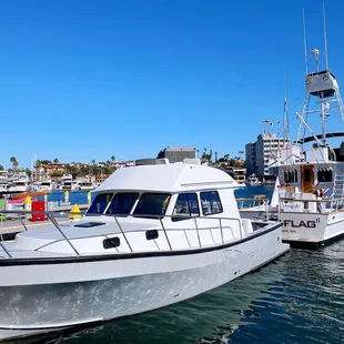 two boats docked at a dock