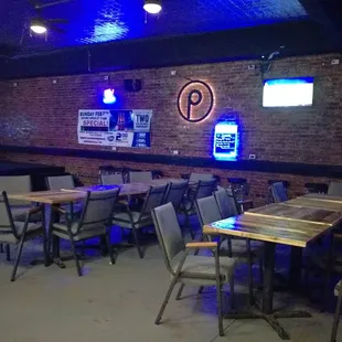 tables and chairs with neon lights