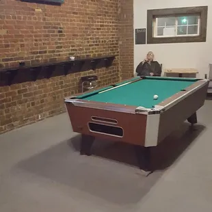 a pool table and a television