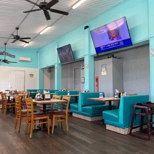 a dining area with a flat screen tv