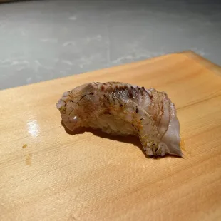 a piece of meat on a cutting board