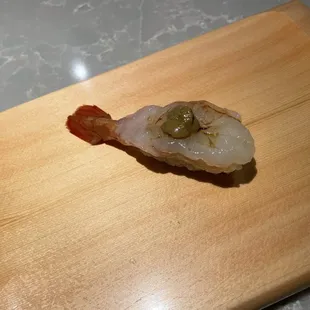 a piece of food on a cutting board