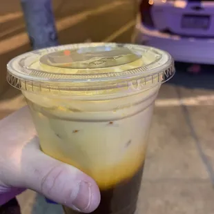 Some kind of delicious Thai Iced Tea. Mango? (compliments of the manager).