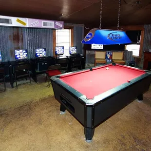 a pool table in the middle of the room