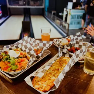 two trays of food on a table