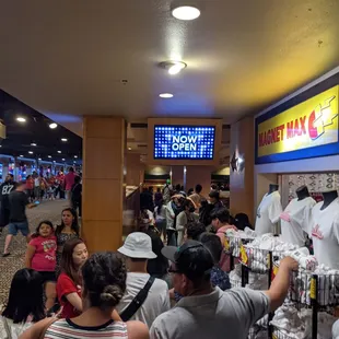 a crowd of people in a shopping mall