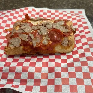 Sicilian slice with pepperoni and sausage