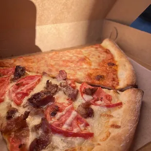 a slice of pizza in a box