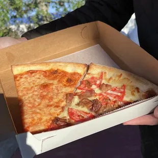 a slice of pizza in a box