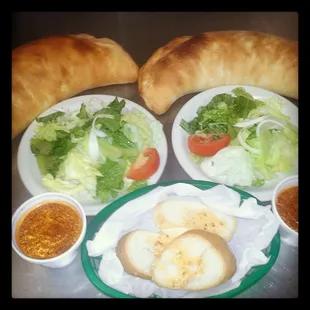 a plate of salad and bread