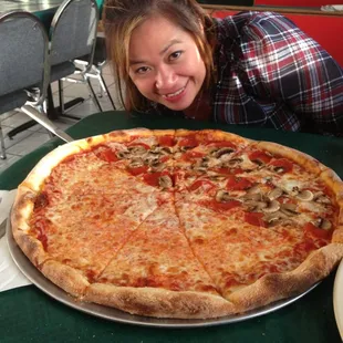 18" pizza half cheese, half pepperoni and mushroom.