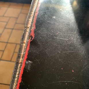 Food/crumbs wedged between the table and the lining. The menus were alll torn up and stickie! No pride in the restaurant.