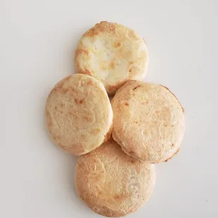 four biscuits on a white plate