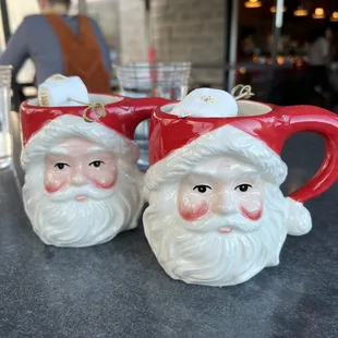 two santa claus mugs