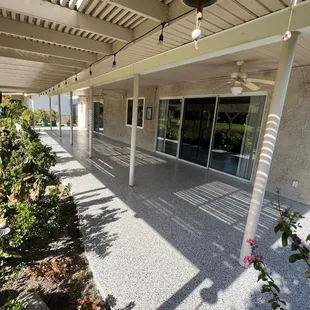 a patio with a pergol roof