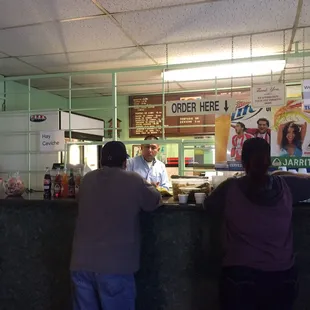 two people standing at a counter