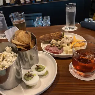 Snacks, cheese board, an drinks at the bar