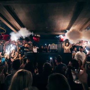 a crowd of people at a party