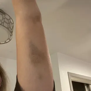 a woman's arm with a tattoo on it