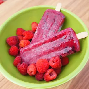 raspberries in a green bowl