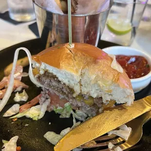 a half eaten sandwich on a plate