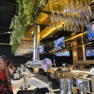 a woman sitting at a bar